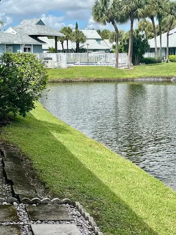 a view of a lake with a building in the background