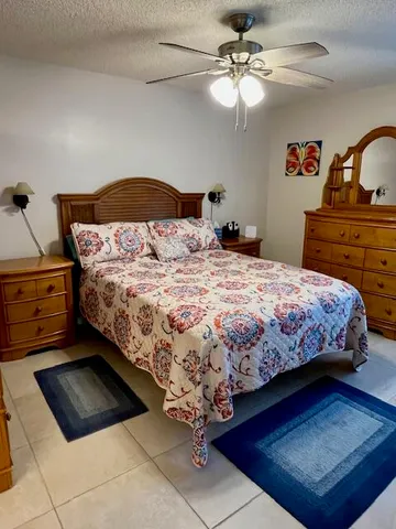 a bedroom with a bed and dresser