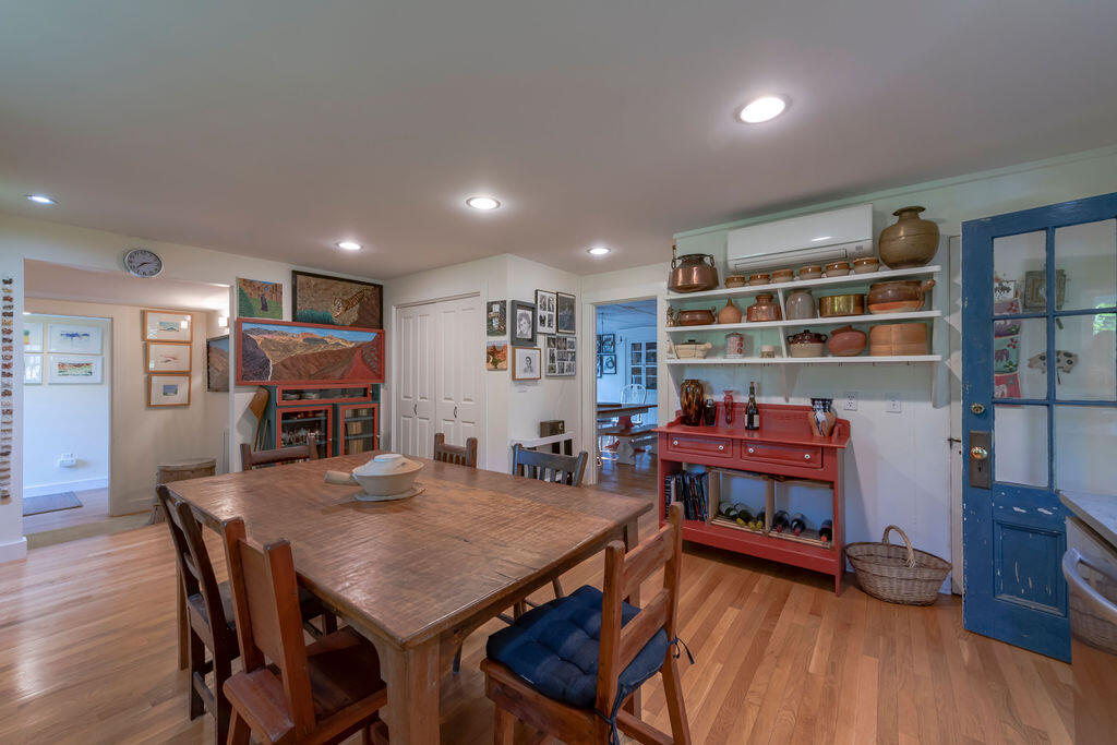 160 Paine Hollow Road Wellfleet, MA 02667 - Photo 11 of 71 a view of a dining room with furniture and wooden floor