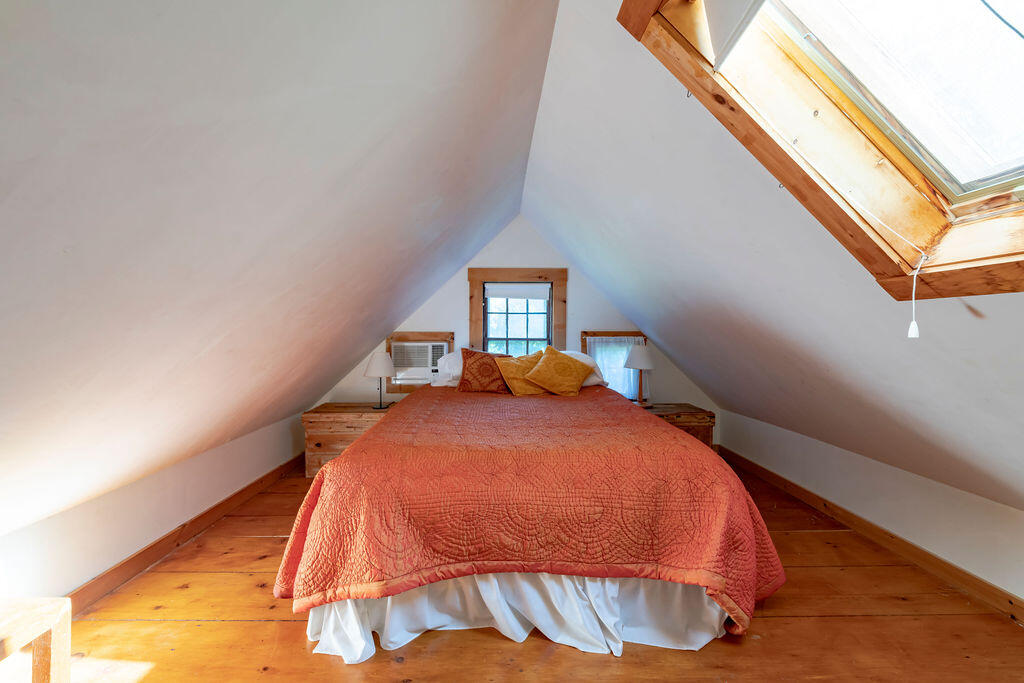 160 Paine Hollow Road Wellfleet, MA 02667 - Photo 44 of 71 a bed sitting in a bedroom next to a window