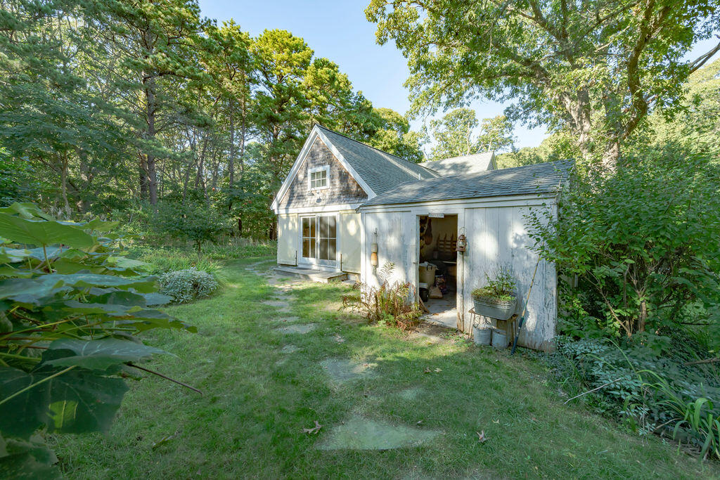 160 Paine Hollow Road Wellfleet, MA 02667 - Photo 47 of 71 a view of a house with a backyard