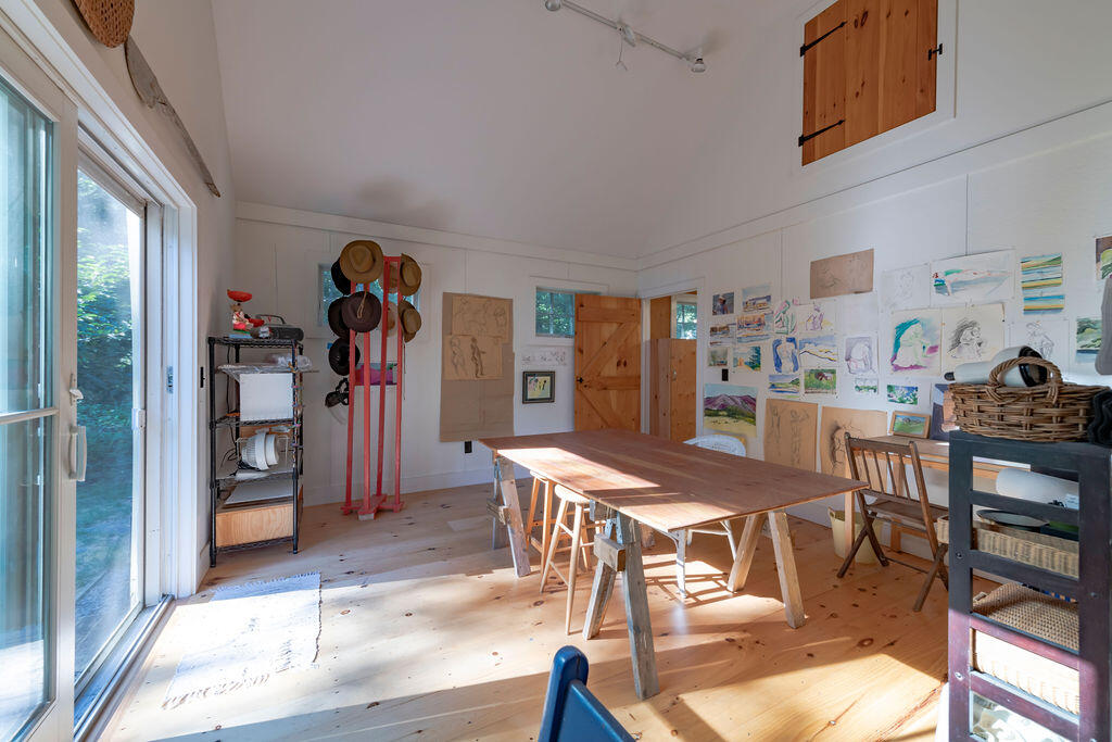 160 Paine Hollow Road Wellfleet, MA 02667 - Photo 50 of 71 a view of a dining room with furniture and a kitchen
