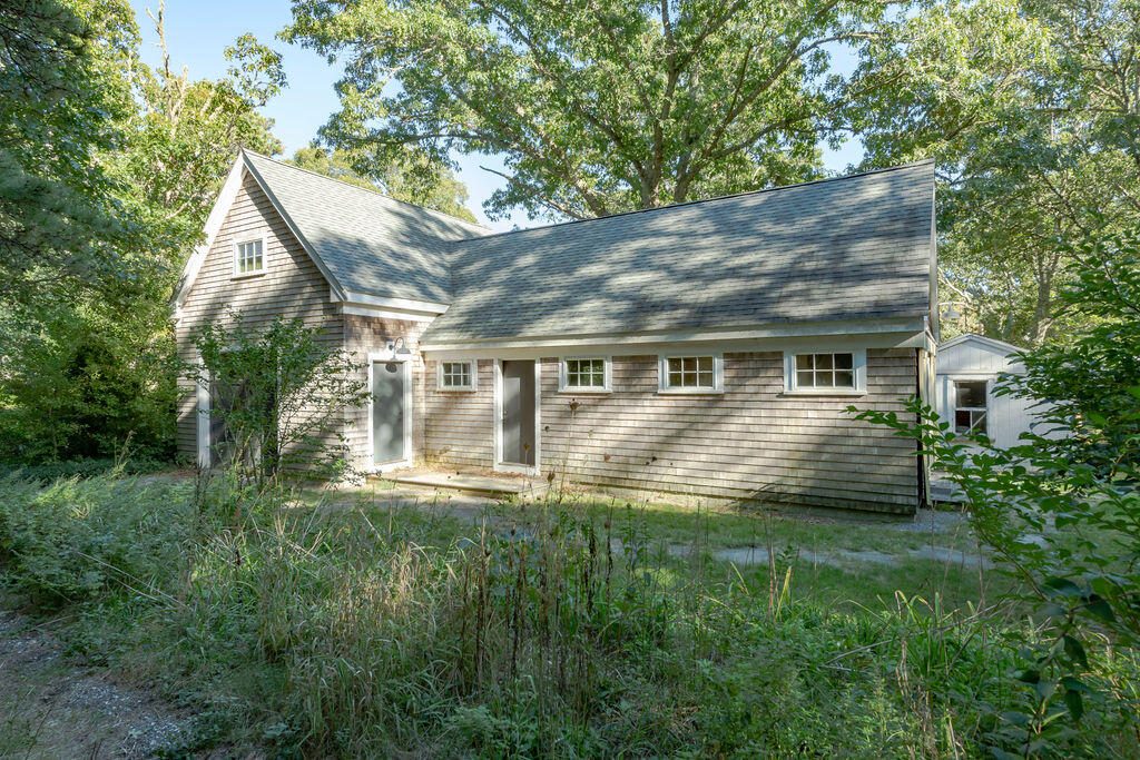 160 Paine Hollow Road Wellfleet, MA 02667 - Photo 57 of 71 a front view of house with yard and green space