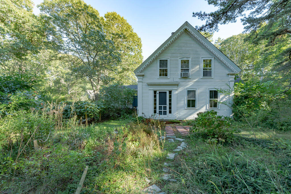 160 Paine Hollow Road Wellfleet, MA 02667 - Photo 58 of 71 a view of a house with yard and sitting area