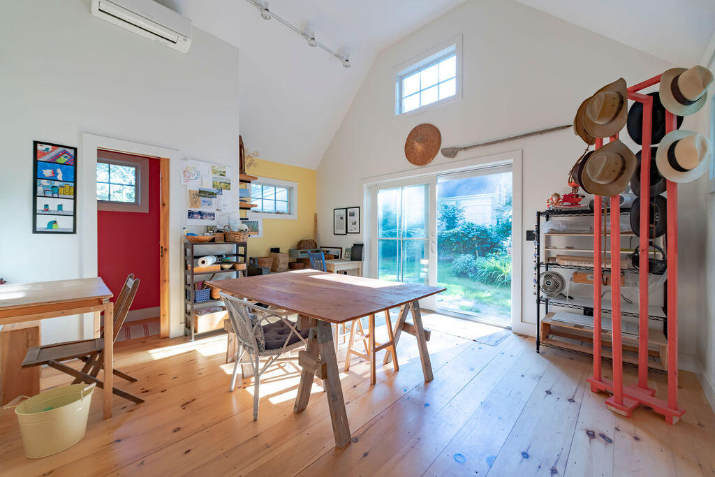 160 Paine Hollow Road Wellfleet, MA 02667 - Photo 6 of 71 a view of a dining room with furniture and wooden floor