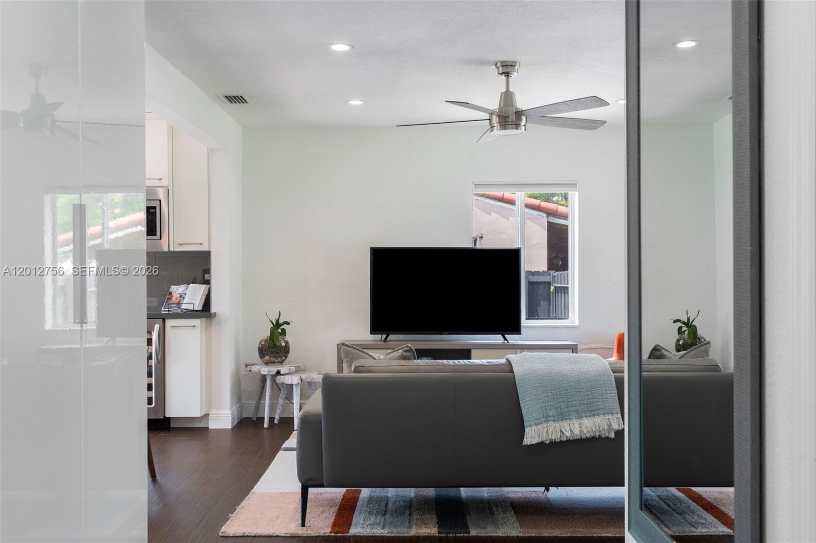 4370 Southwest 11th Street Miami, FL 33134 - Photo 14 of 21 a view of a livingroom with furniture and a flat screen tv