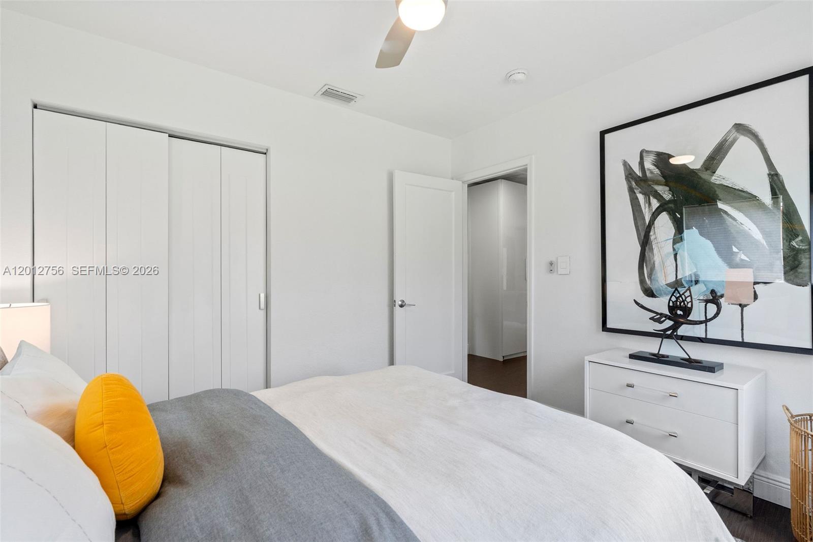 4370 Southwest 11th Street Miami, FL 33134 - Photo 16 of 21 a bedroom with a bed and a mirror