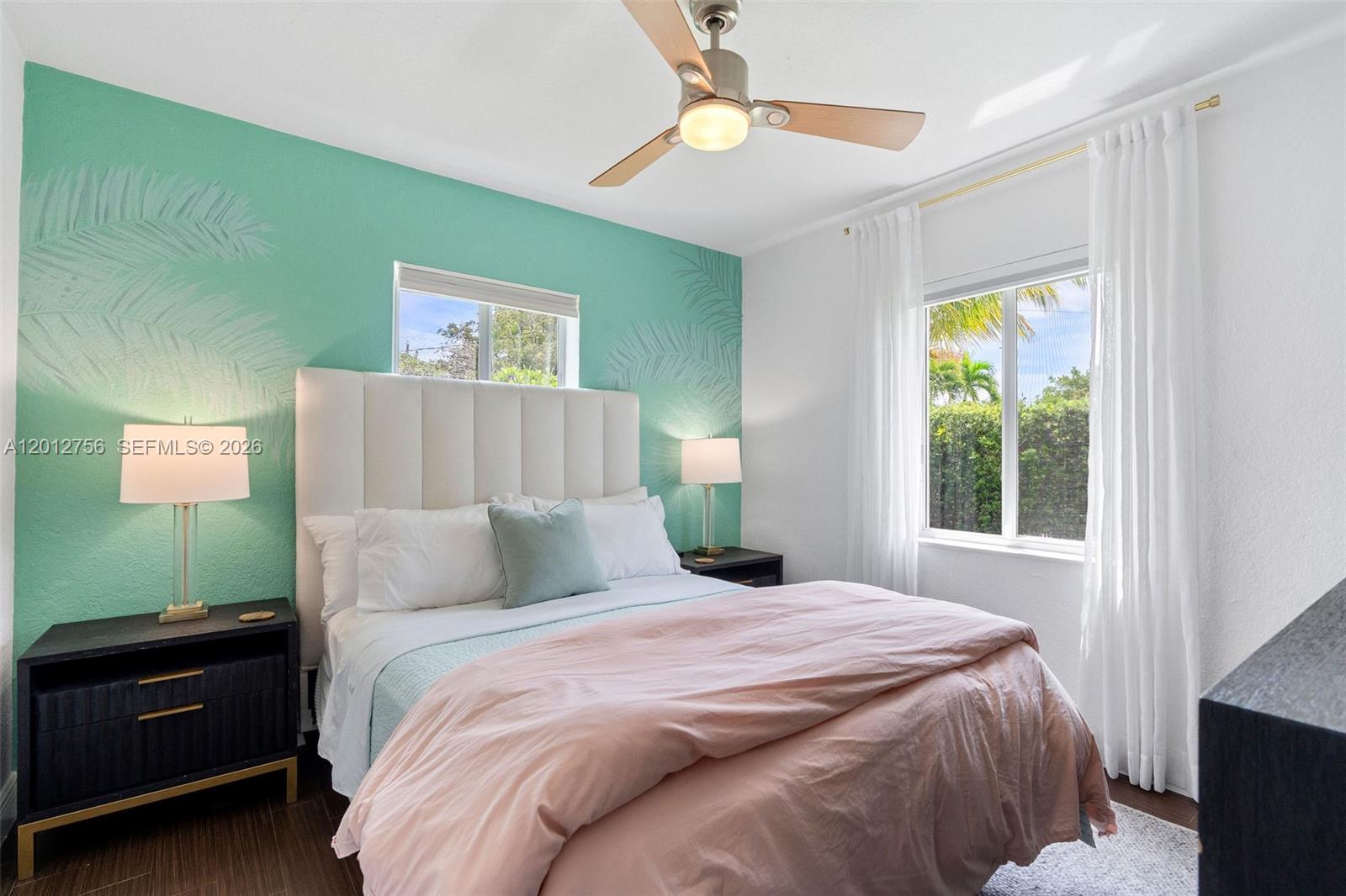 4370 Southwest 11th Street Miami, FL 33134 - Photo 17 of 21 a bedroom with a bed and a window