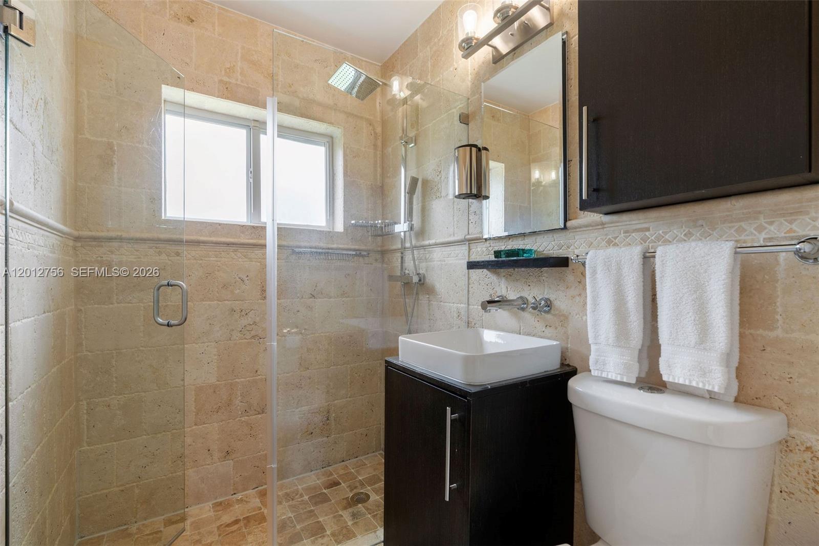 4370 Southwest 11th Street Miami, FL 33134 - Photo 20 of 21 a bathroom with a sink toilet and shower