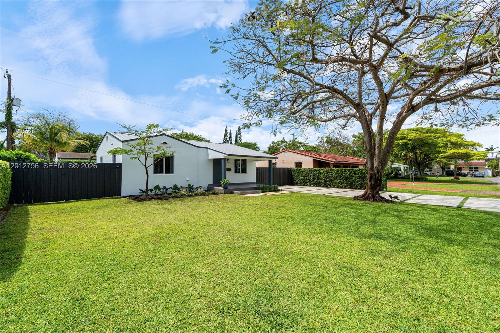 4370 Southwest 11th Street Miami, FL 33134 - Photo 4 of 21 a front view of house with yard and trees
