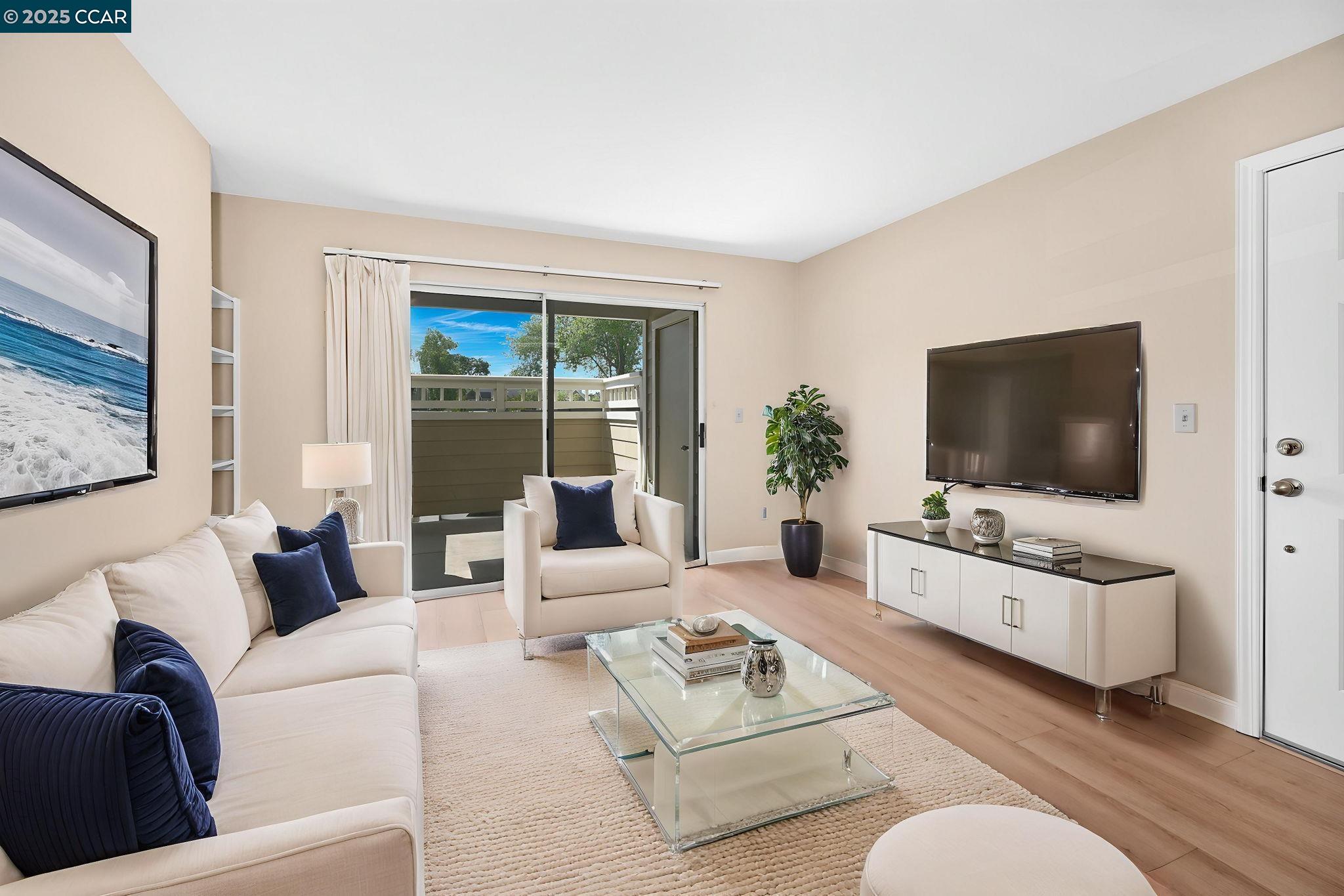 a living room with furniture and a flat screen tv