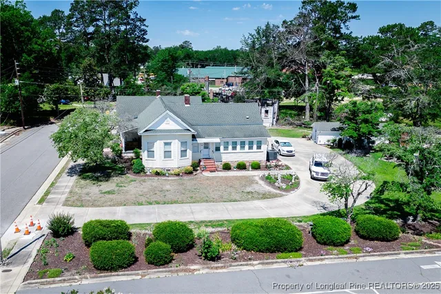 a aerial view of a house with a garden and plants