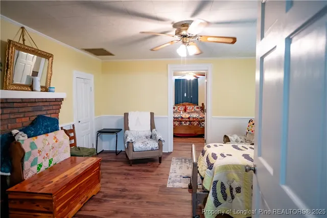 a bed room with furniture and a chandelier