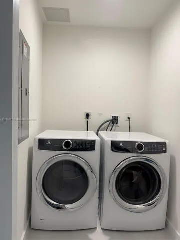 a kitchen with stainless steel appliances a sink a stove and a refrigerator