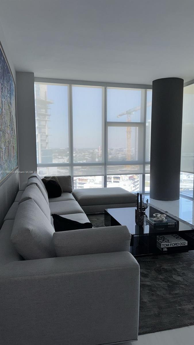 851 Northeast 1st Avenue, Unit 1401 Miami, FL 33132 - Photo 27 of 38 a living room with furniture and two window