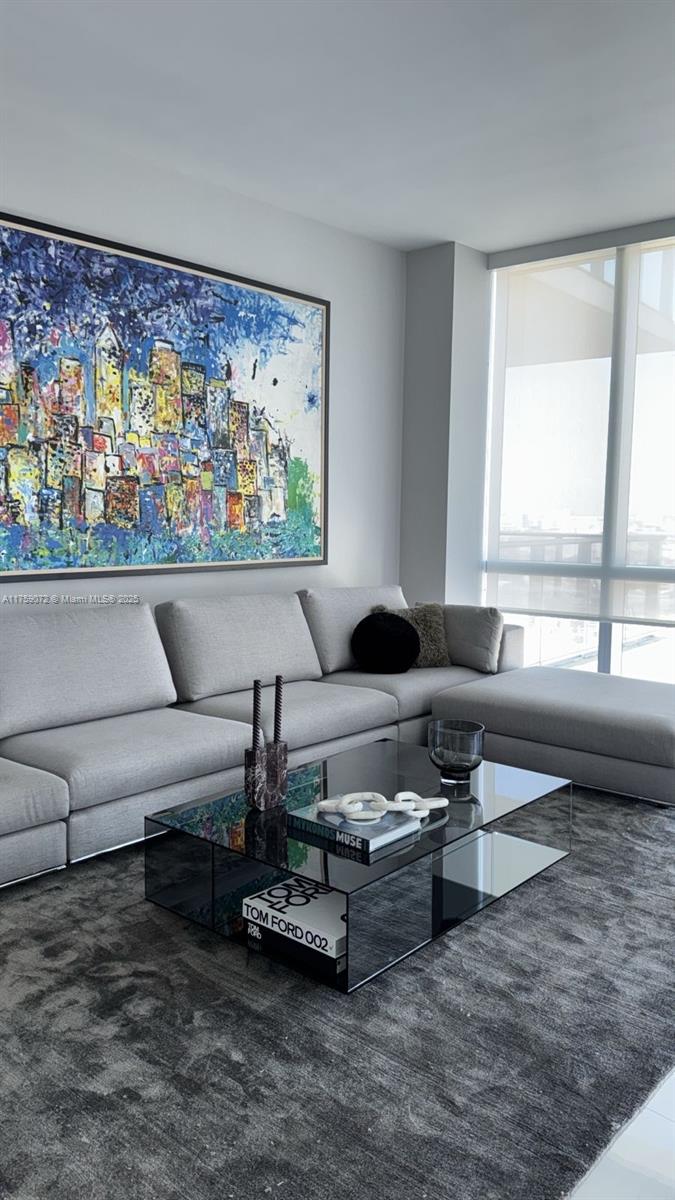 851 Northeast 1st Avenue, Unit 1401 Miami, FL 33132 - Photo 29 of 38 a living room with furniture and a large window
