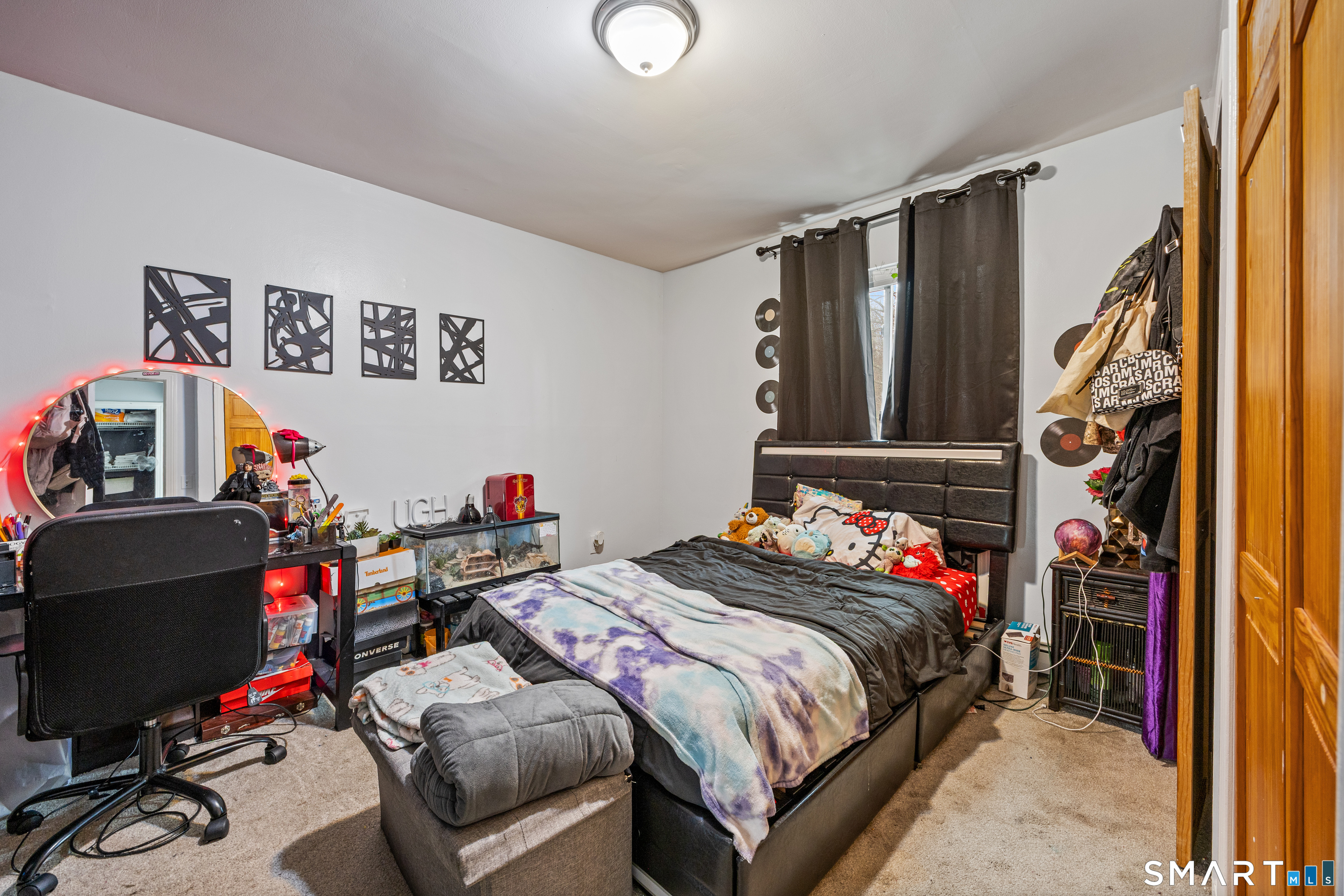 105 Pond Street Bridgeport, CT 06606 - Photo 16 of 26 a bedroom with a bed and a window