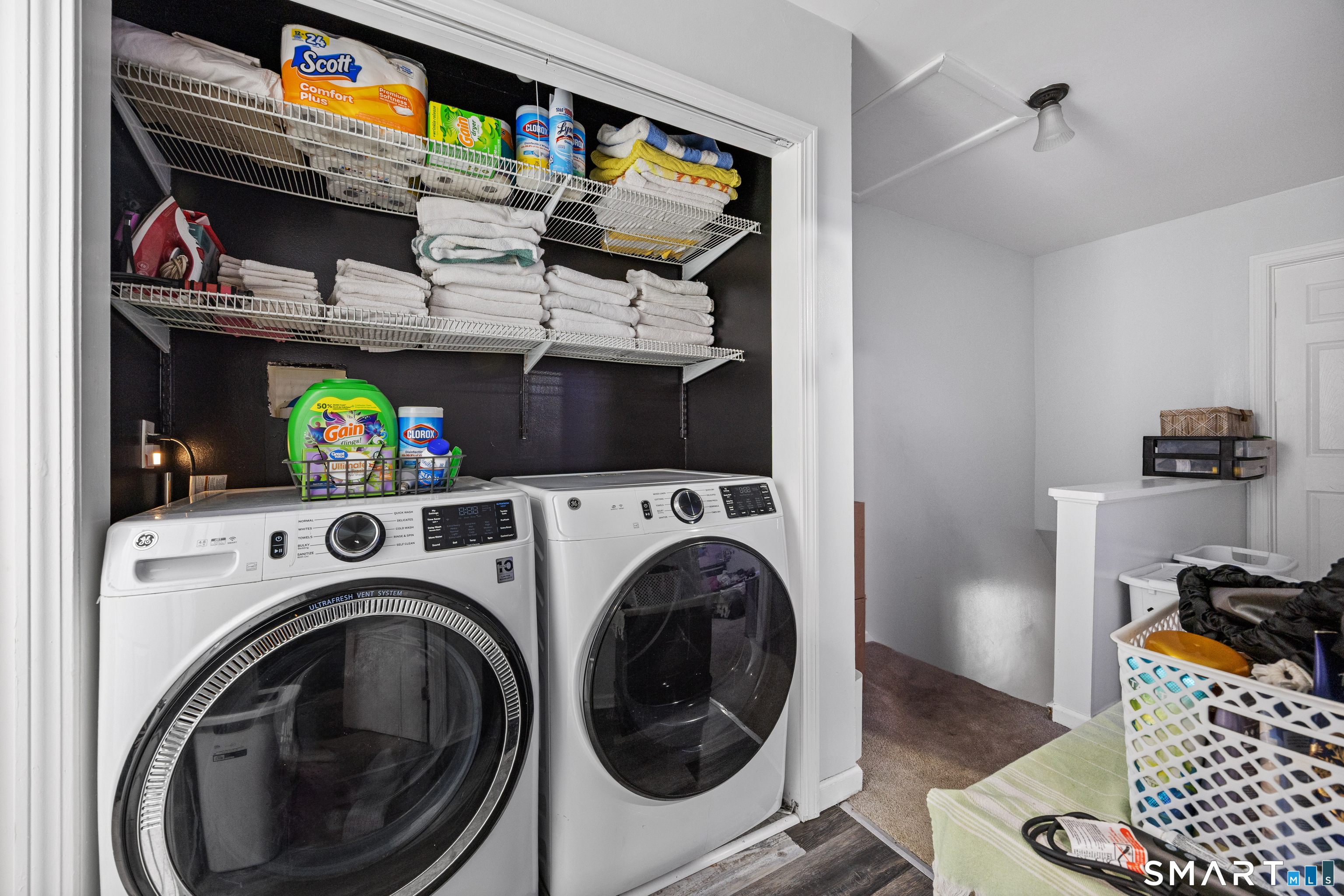 105 Pond Street Bridgeport, CT 06606 - Photo 18 of 26 a utility room with dryer washer and a view of living room
