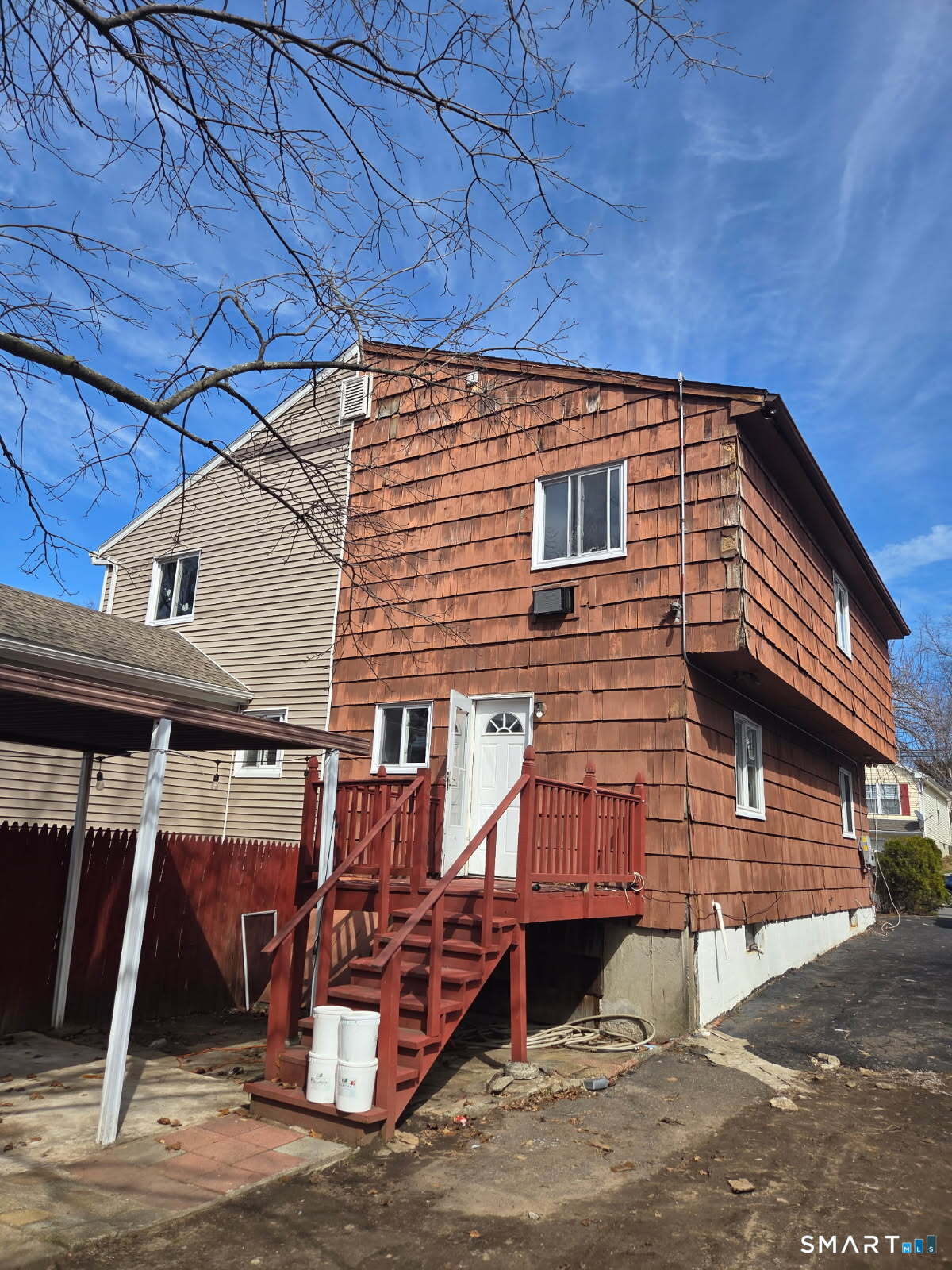 105 Pond Street Bridgeport, CT 06606 - Photo 2 of 26 a view of a house with a patio