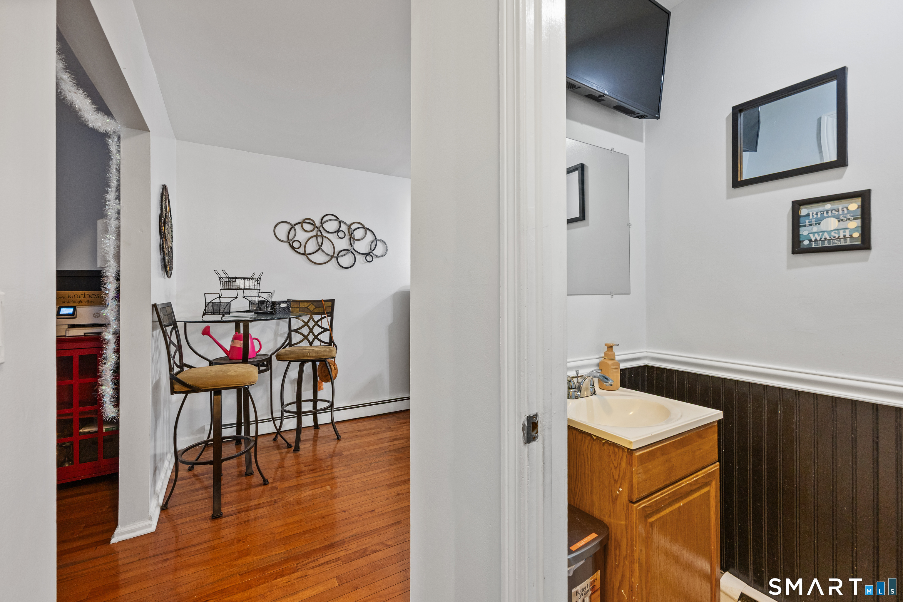 105 Pond Street Bridgeport, CT 06606 - Photo 7 of 26 a view of a room with wooden floor and furniture
