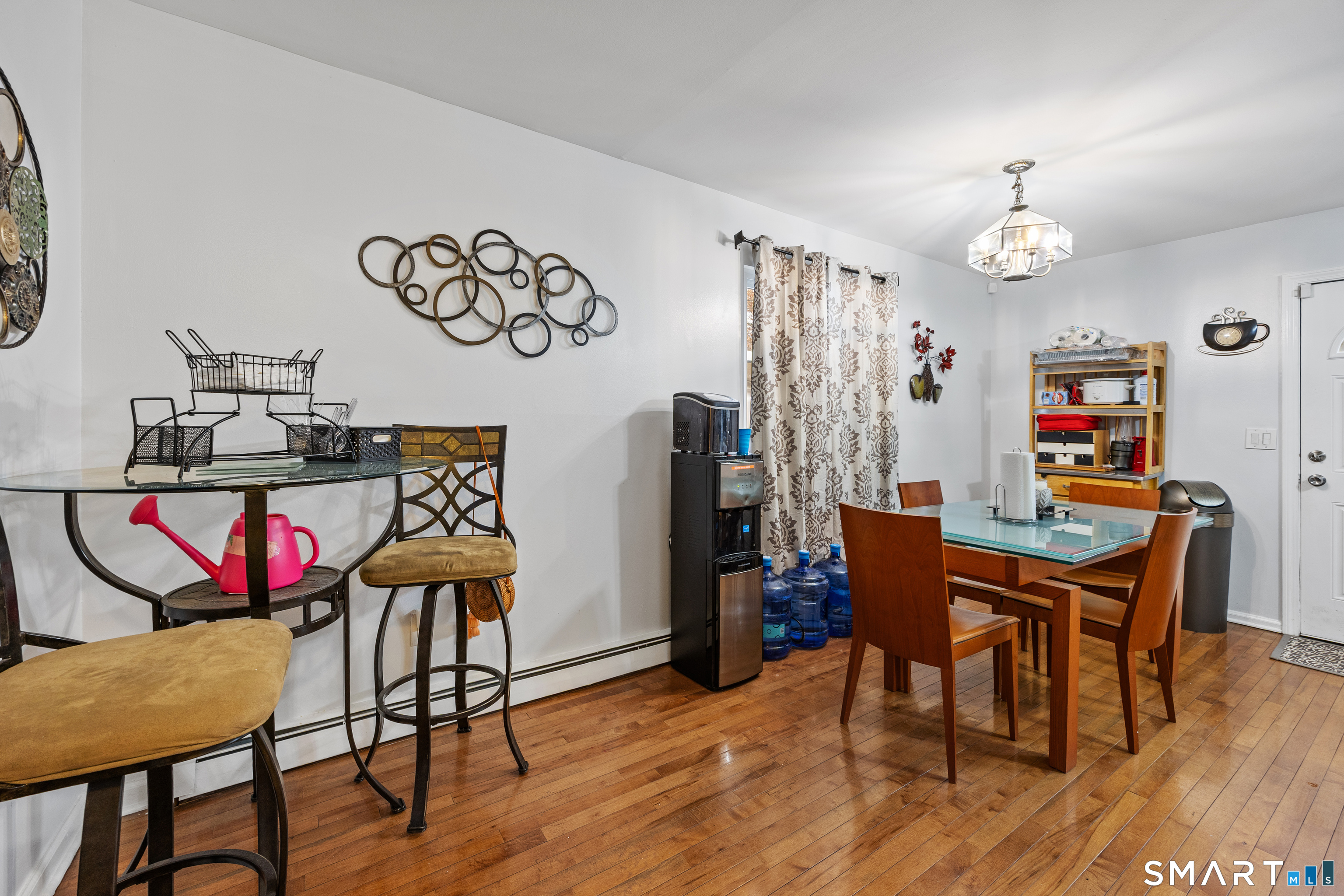 105 Pond Street Bridgeport, CT 06606 - Photo 8 of 26 a view of a dining room with furniture window and wooden floor