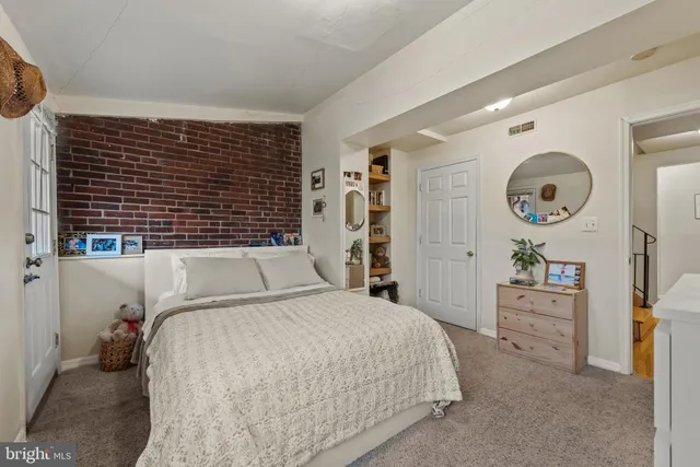 a bedroom with a bed and a cabinets