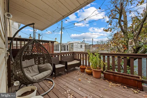 a view of a two chairs in the balcony
