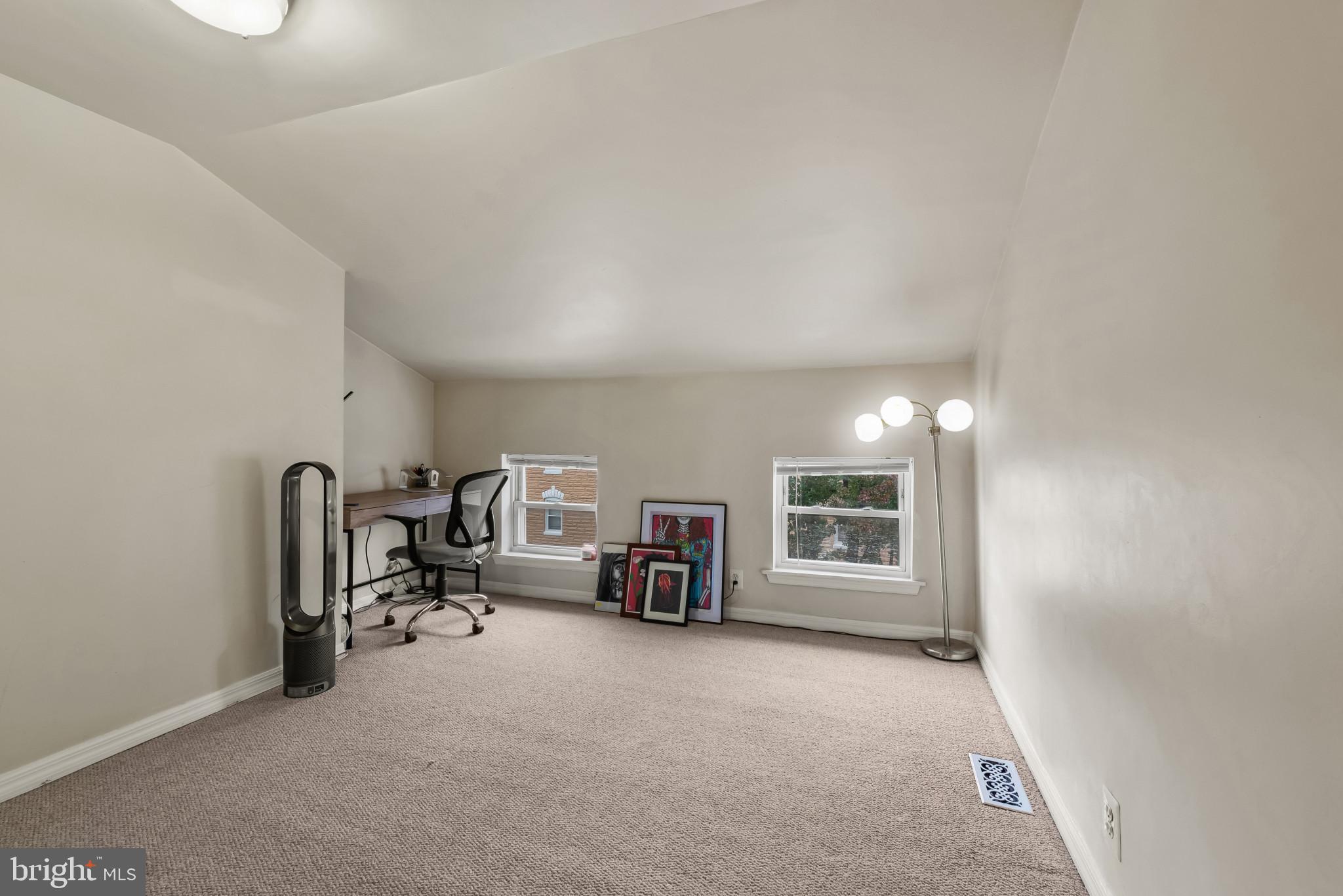 1807 East Lombard Street Baltimore, MD 21231 - Photo 17 of 30 a view of a livingroom with furniture and a window