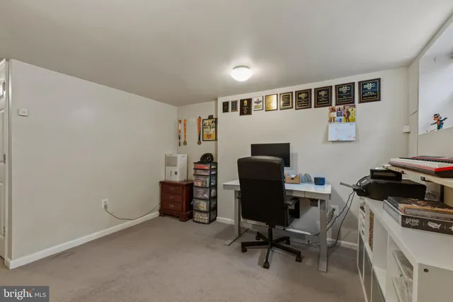 a view of a workspace with furniture