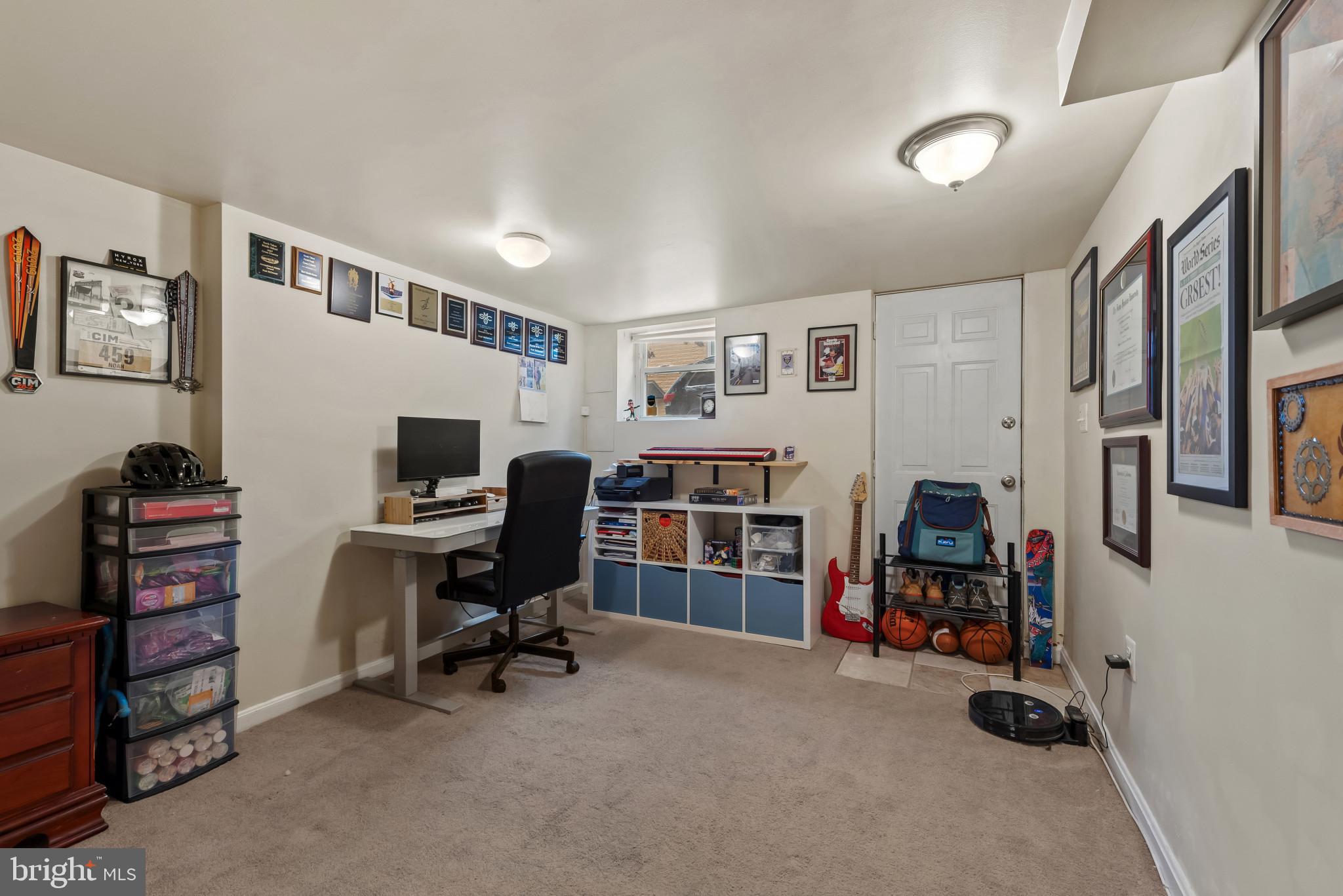 1807 East Lombard Street Baltimore, MD 21231 - Photo 21 of 30 a view of a livingroom with workspace and a window
