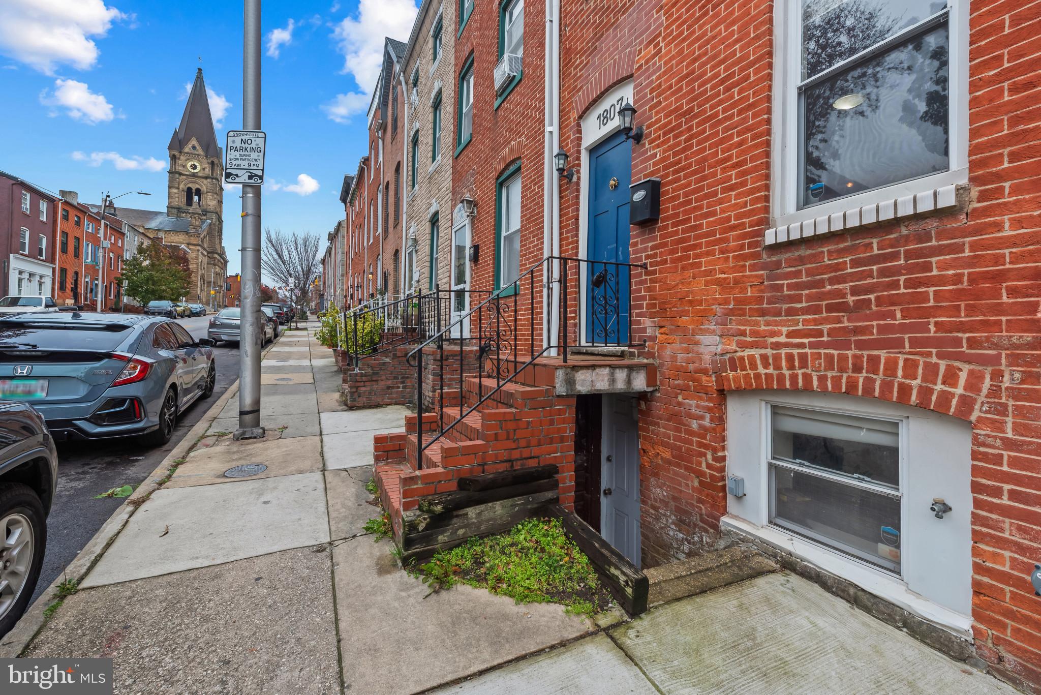 1807 East Lombard Street Baltimore, MD 21231 - Photo 25 of 30 a view of a brick house with many windows