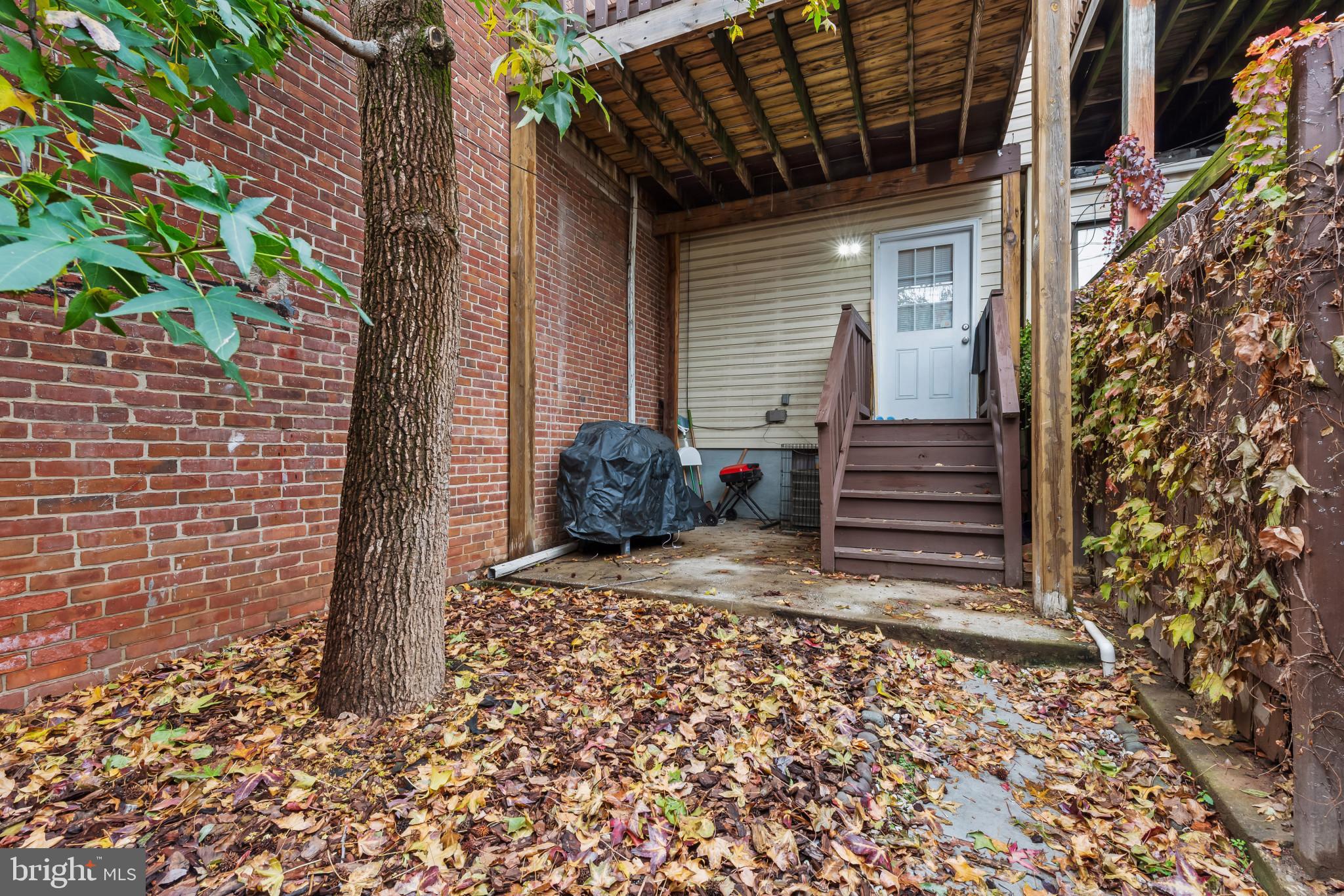 1807 East Lombard Street Baltimore, MD 21231 - Photo 27 of 30 a view of a pathway of a house with wooden fence
