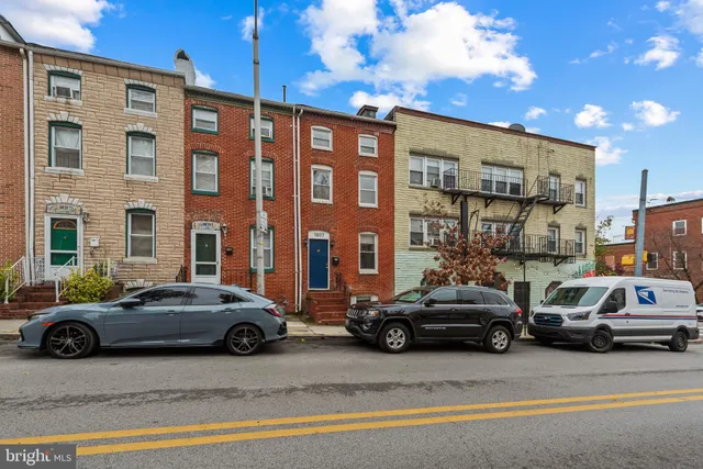 a view of a cars parked in front of a building