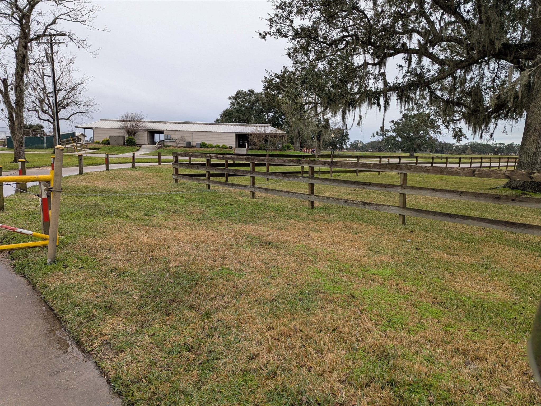 861 Longhorn Trail Angleton, TX 77515 - Photo 5 of 6 a view of a park with large trees