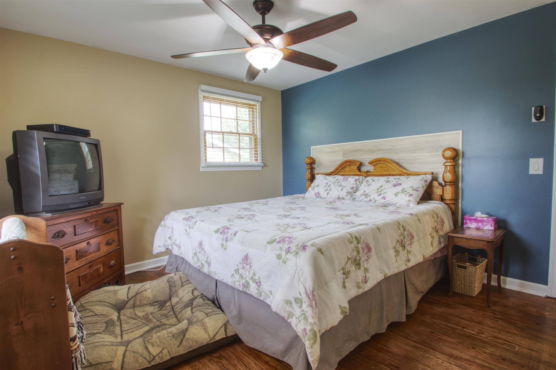 503 Terry Lane Lebanon, TN 37087 - Photo 12 of 16 a bedroom with a bed and wooden floor