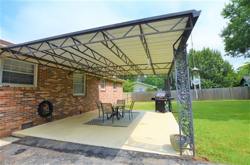 503 Terry Lane Lebanon, TN 37087 - Photo 14 of 16 a view of a backyard with table and chairs with wooden floor and fence