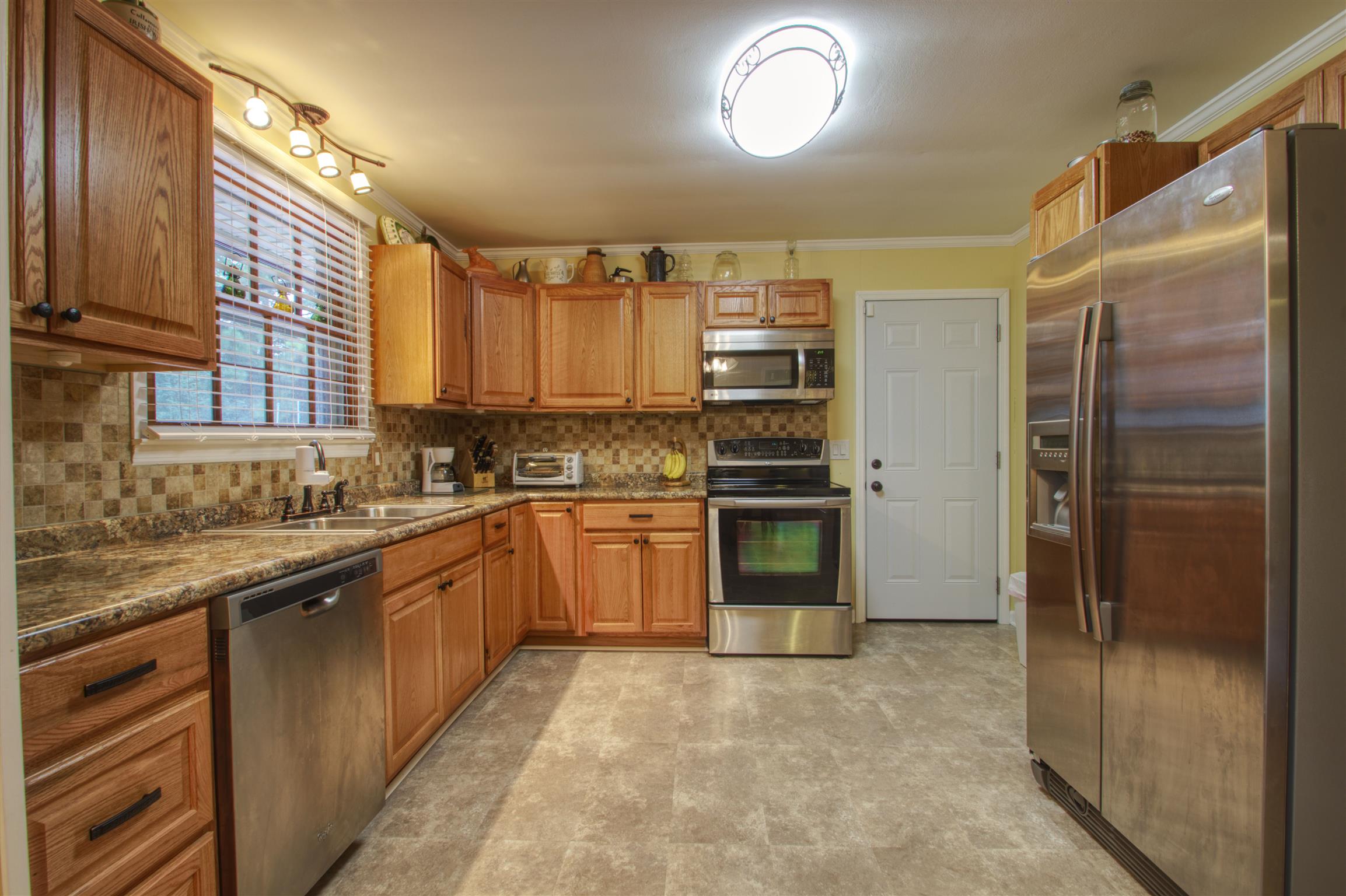503 Terry Lane Lebanon, TN 37087 - Photo 5 of 16 a kitchen with stainless steel appliances granite countertop a refrigerator and a sink