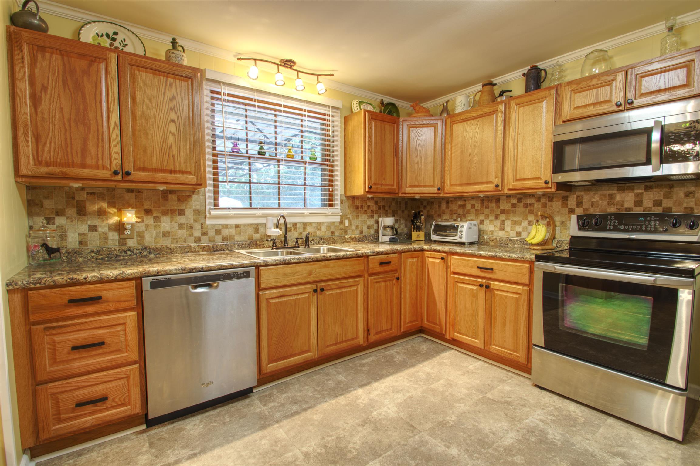 503 Terry Lane Lebanon, TN 37087 - Photo 6 of 16 a kitchen with stainless steel appliances granite countertop a stove sink and cabinets