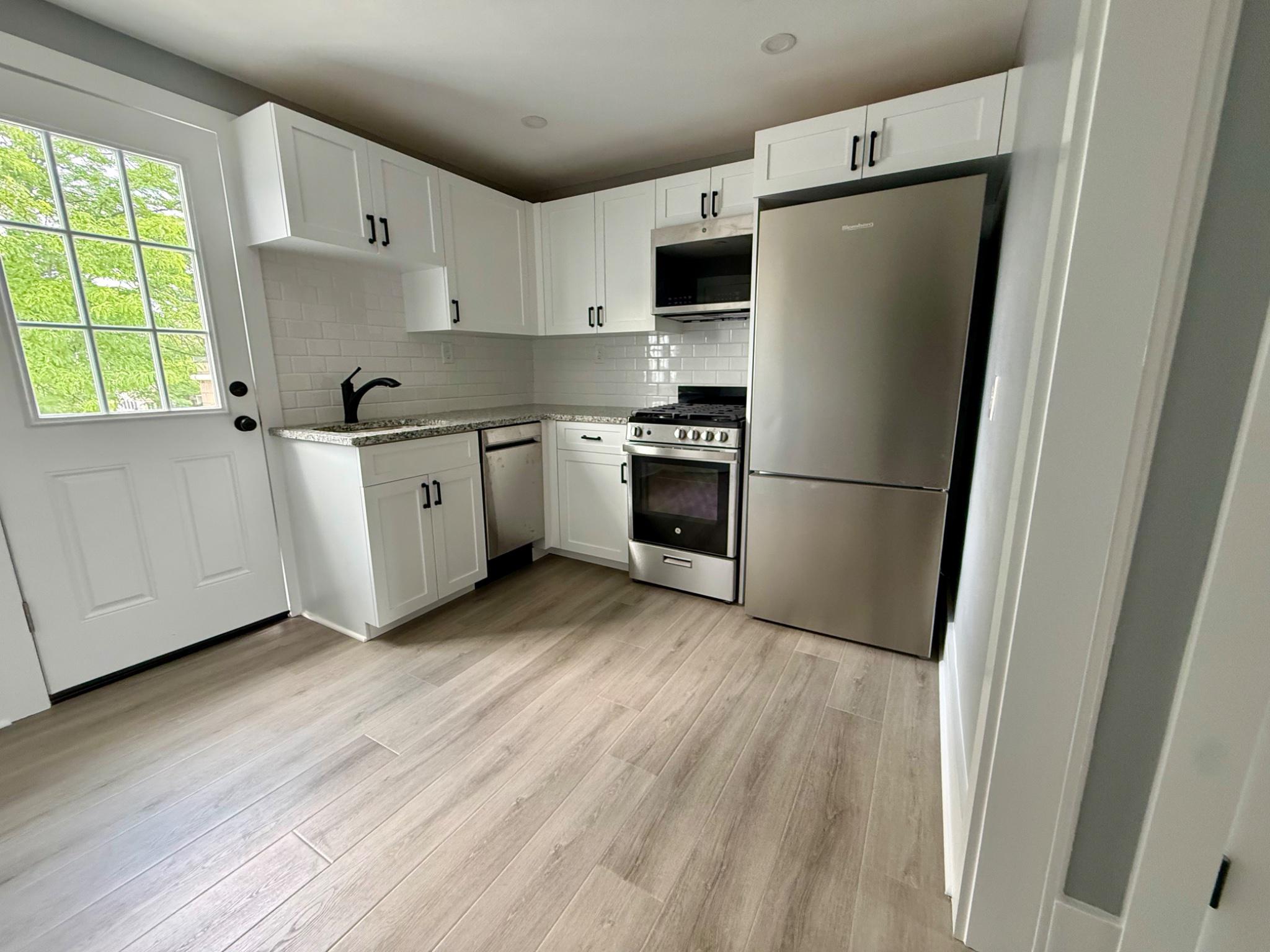 25 West State Street Doylestown, PA 18901 - Photo 2 of 10 Renovated kitchen with brand new appliances