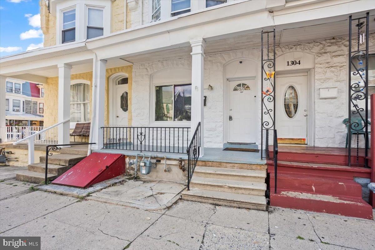 1302 North 11th Street Reading, PA 19604 - Photo 2 of 16 a view of a balcony with chairs and wooden floor