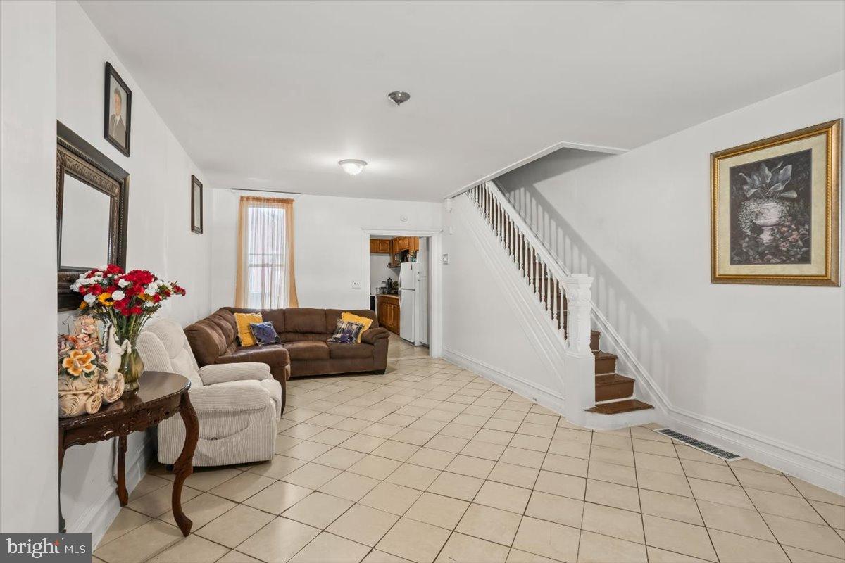 1302 North 11th Street Reading, PA 19604 - Photo 4 of 16 a living room with furniture and a potted plant