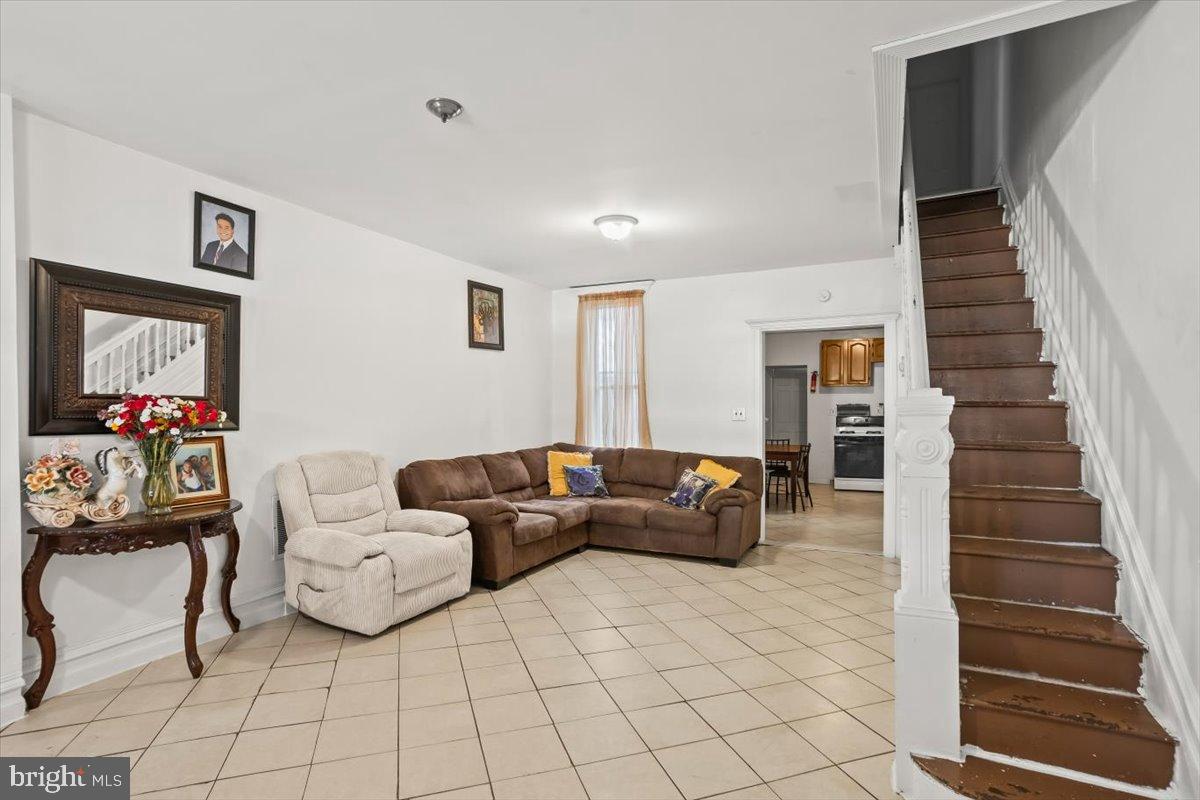 1302 North 11th Street Reading, PA 19604 - Photo 6 of 16 a living room with furniture and a flat screen tv