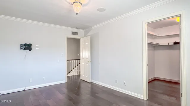a view of an empty room with a fan