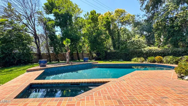an aerial view of a house with outdoor space