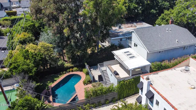 an aerial view of a house with a yard and garden