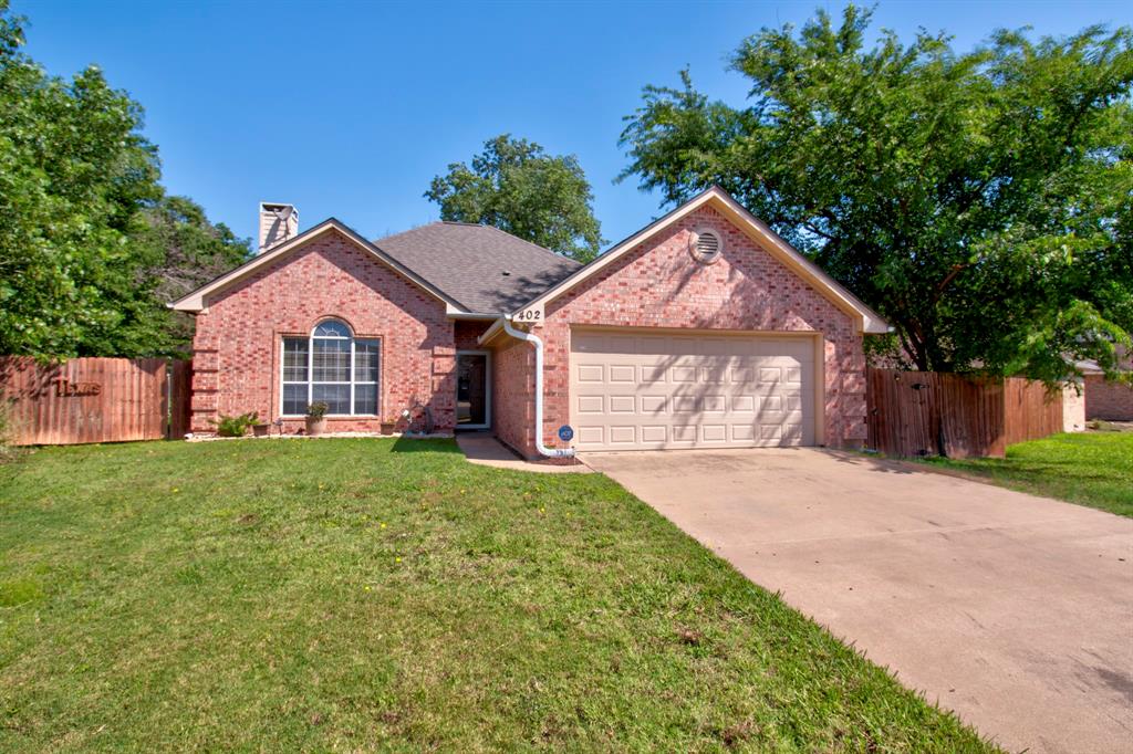 402 Willow Road Aubrey, TX 76227 - Photo 1 of 1 a front view of a house with a yard and garage