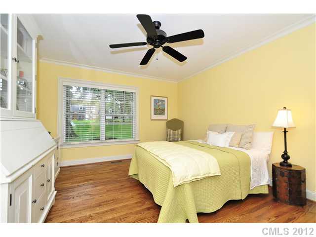 142 McAlway Road Charlotte, NC 28211 - Photo 11 of 16 a bedroom with a bed and a large window