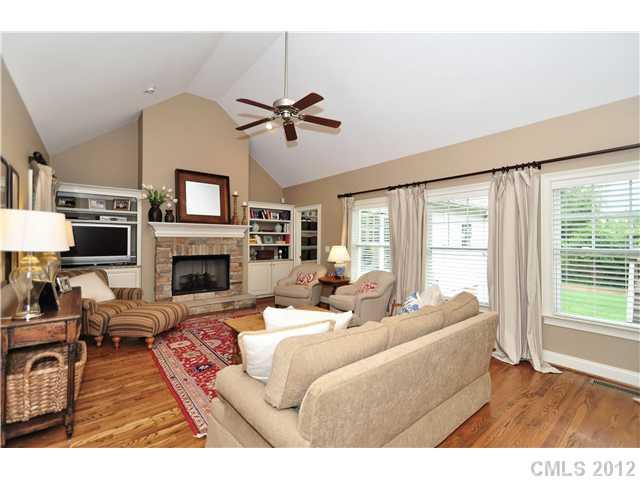 142 McAlway Road Charlotte, NC 28211 - Photo 3 of 16 a living room with furniture a fireplace and a flat screen tv