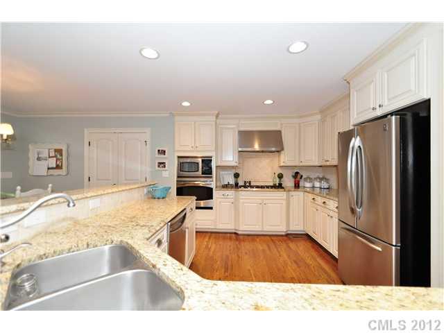 142 McAlway Road Charlotte, NC 28211 - Photo 5 of 16 a kitchen with granite countertop a refrigerator and a sink
