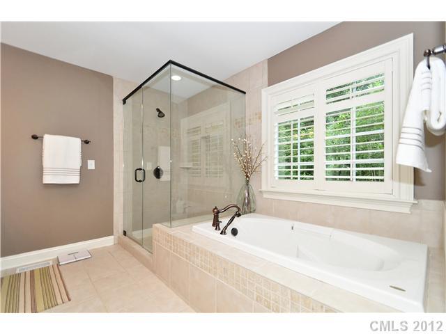 142 McAlway Road Charlotte, NC 28211 - Photo 9 of 16 a bathroom with a bathtub and a shower